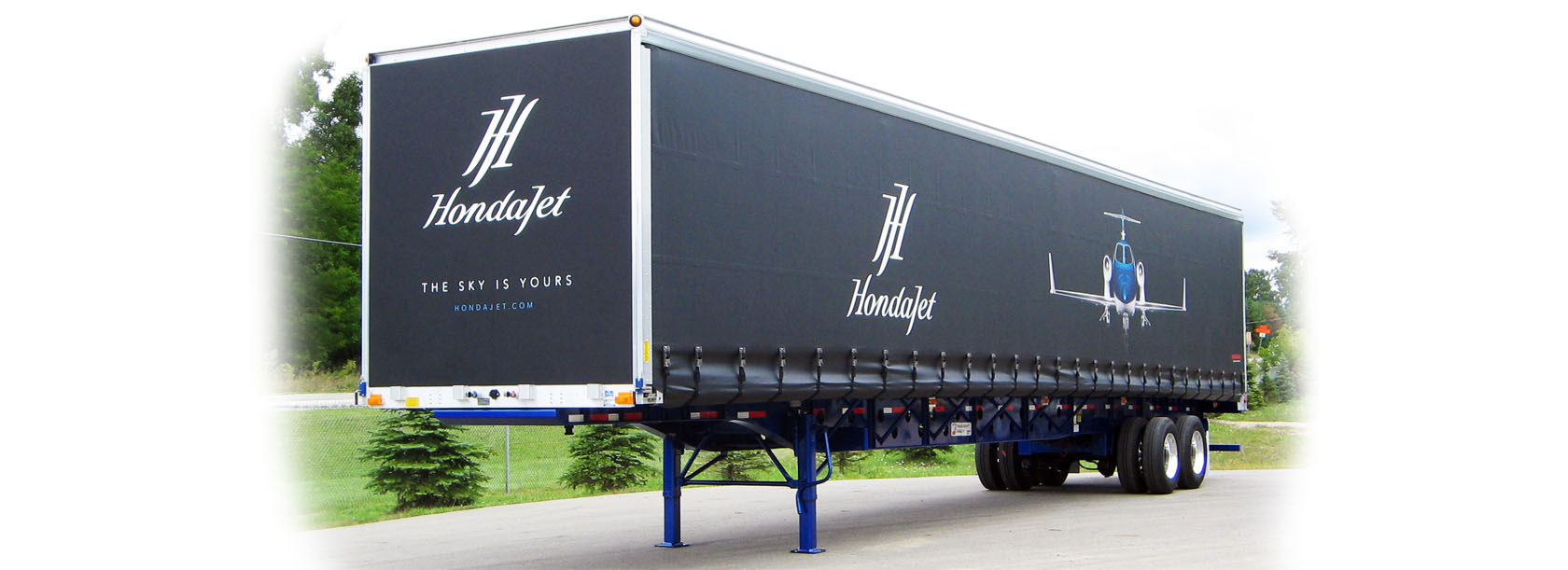 Advertise your fleet with a custom vinyl side curtain & make your trucks stand out.